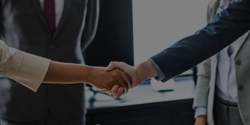 Handshake In A Boardroom